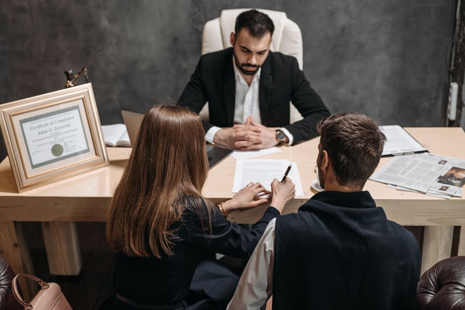 immigration attorney reviewing legal documents with a client - attorney for citizenship immigration attorney reviewing legal documents with a client - attorney for citizenship